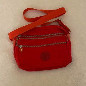 fjallraven kanken style kipling red bag